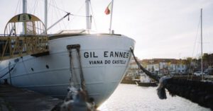 Hostels - A boat docked at a dock with a sign that says gilfran