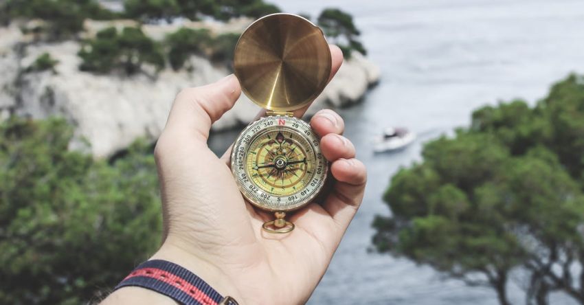 Trip - Person Holding Compass